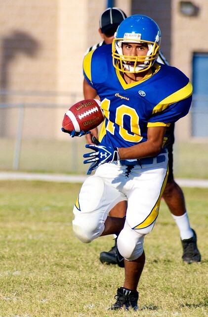 football player running with football